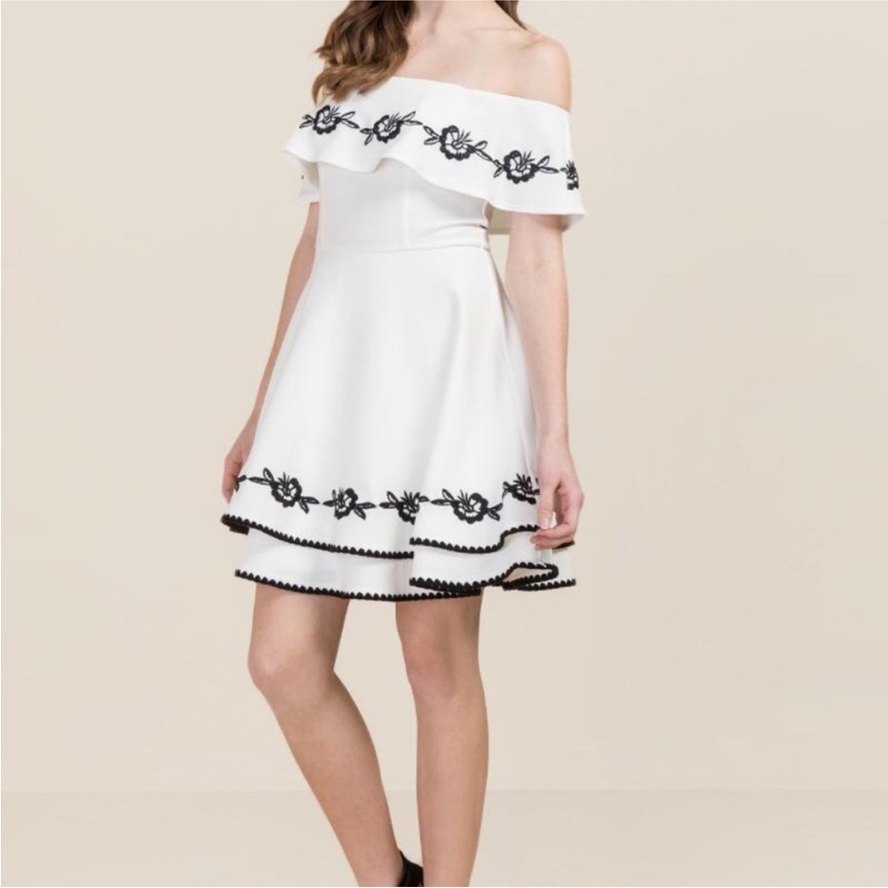 Off the shoulder white dress with black embroidery